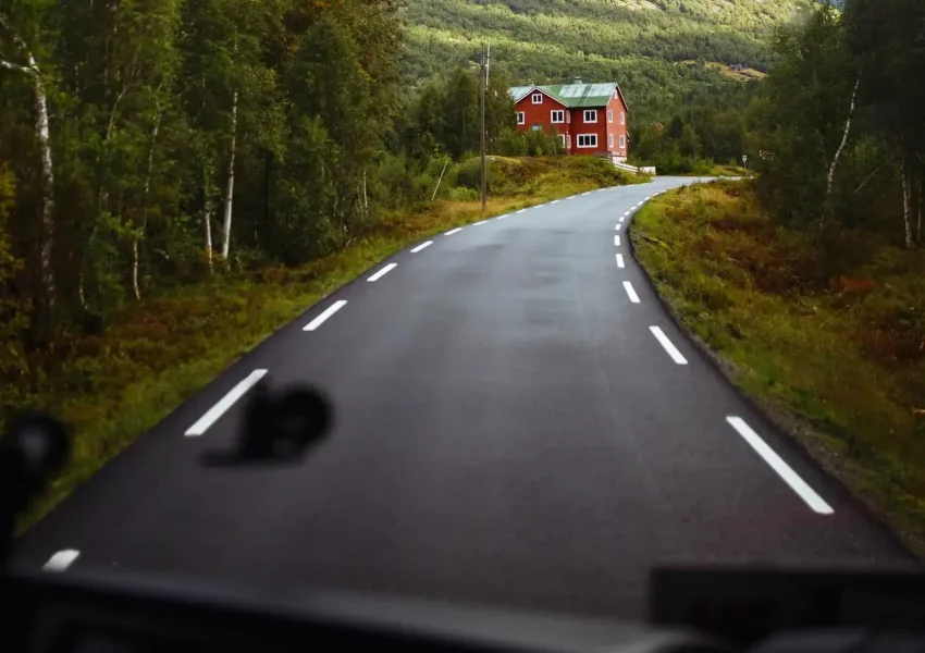 Norway road landscape on high mountains. Photo of the road among the mountains from the bus window.